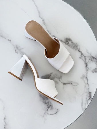 Summer white sandals. woman shoes with high heels. fashion still lifeの写真素材
