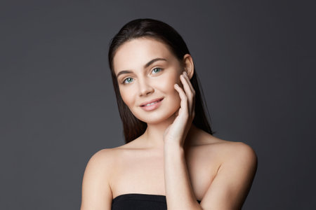 beautiful happy young woman. pretty smiling brunette model girl. sweet modelの写真素材