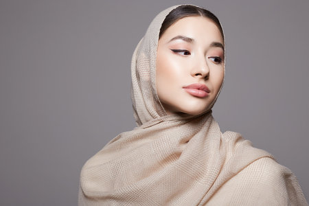 beautiful islamic young woman with make-up. beauty girl in hijab. fashion oriental style model. Asianの写真素材