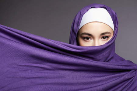 beautiful islamic young woman. beauty girl in hijab. fashion oriental style model. Asian eyesの写真素材