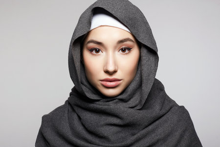 beautiful young woman in hijab or scarf. fashion muslim girl portrait. religionの写真素材