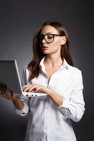 beautiful business woman in glasses. pretty girl laptop. Studentの写真素材