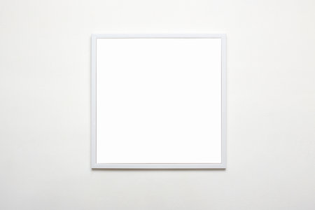 white picture frame on wall. Stylish modern square photoframe for poster or picture. template for presentation your photo art or other craftsの写真素材