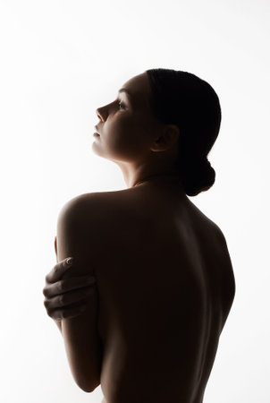 portrait of Beautiful naked Woman. Nude Girl. Female body silhouetteの写真素材