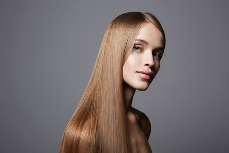 beautiful blond young woman. beauty portrait of smiling girl with Heathy hairの写真素材
