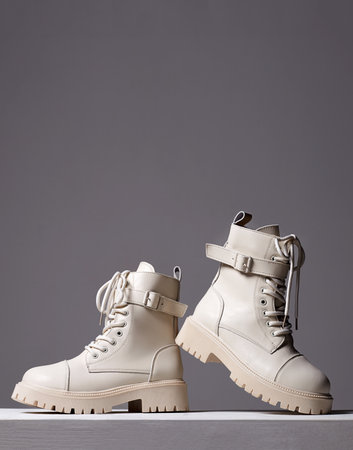 white boots. fashion shoes still life. stylish photo in the studioの写真素材