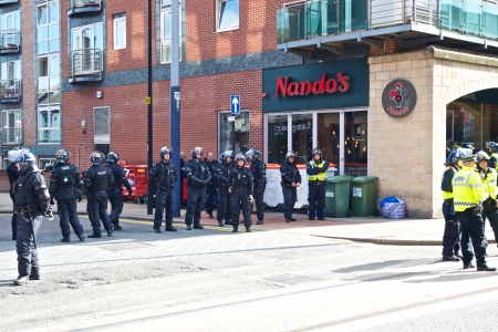 Sheffield, UK - June 8, 2013 - Female police inspector commanding the cordon at English Defence League and United Against Fascism protestのeditorial素材