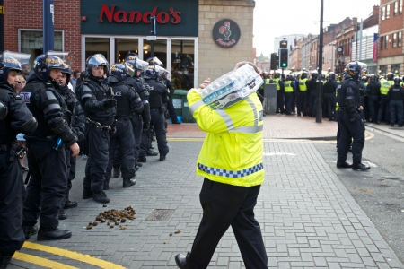 Sheffield, UK - June 8, 2013 - Riot police receiving water at English Defence League and United Against Fascism protestのeditorial素材