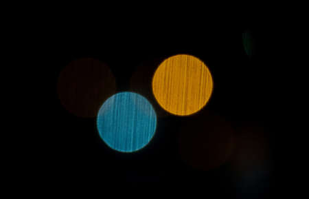 abstract blurred lights look like planets on the dark background