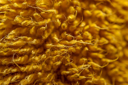 Macro shot of a yellow bath towel texture. Abstract design background.の写真素材