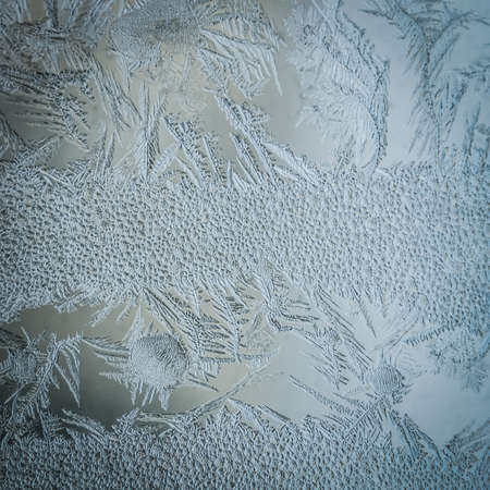 Winter Holidays Season Fantasy World Concept: Macro Image Of A Frosty Window Glass Natural Ice Patterns With Copy Spaceの写真素材