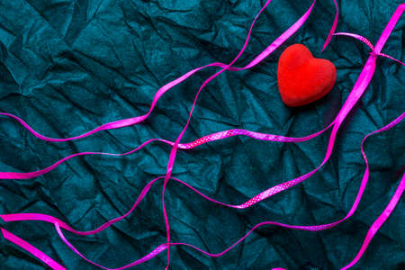 Red Heart And Purple Ribbons With White Polka Dot Pattern On Wrinkled Black Texture Background. Happy Valentine's Day And Love Concept. Romantic Card, Banner Graphic Design Conceptの写真素材