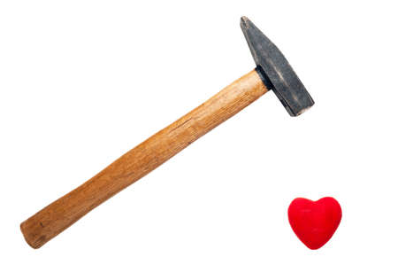 A Hammer with Wooden Handle Ready to Break, Crush Red Heart Isolated on White Background. Minimalist...