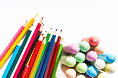 Jumbo Sidewalk Chalk, Bold Tips and Blurred Pencils, Assorted Colors on White Background. Top View....