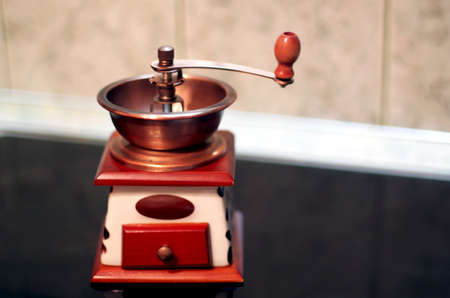 Copper And Wooden Hand Coffee Grinder In The Kitchenの写真素材