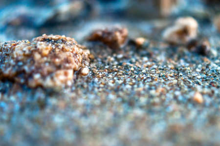 Close-up View of Wet Coarse Sand. Travel Concept.の写真素材