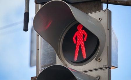 Modern pedestrian traffic lights with red stop signal Modern pedestrian traffic lights with red stop signal