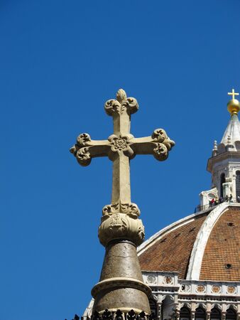 Christian cross with Basilica in background の写真素材