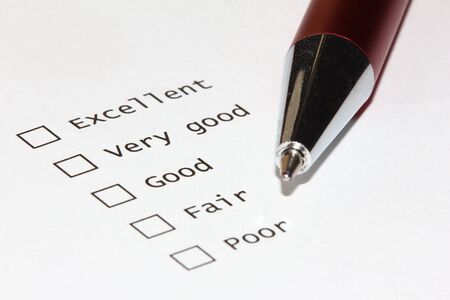 Unmarked checkboxes of a survey with ratings. With penの写真素材