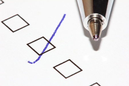 Filled survey question with pen pointing up. Macro viewの写真素材
