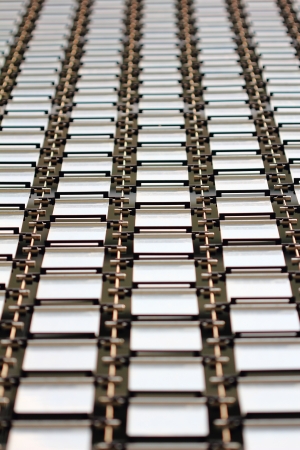 Rows of repeating metal plates on a buildingの写真素材