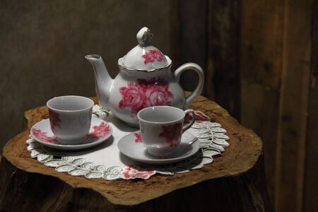 Tea set on a wooden table close upの写真素材