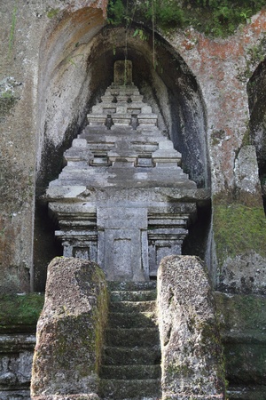 Stone steps leading to a Balinese candi  shrine  which is also carved out of stoneの写真素材