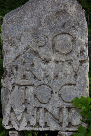 Excavated marble tablet with writing on display at the ancient Roman Forumの写真素材