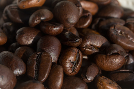 Unground coffee beans under strong directional lightの写真素材