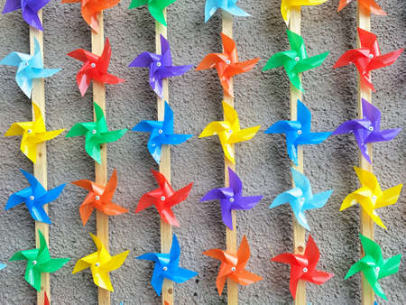 Children's toy early-colored windmill, pinwheels, wind vane pinwheel. Icon. Vector design.