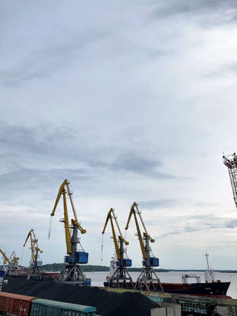 Cranes in the seaport, freight trains, machinery coal, shipbuilding, sea freightの写真素材