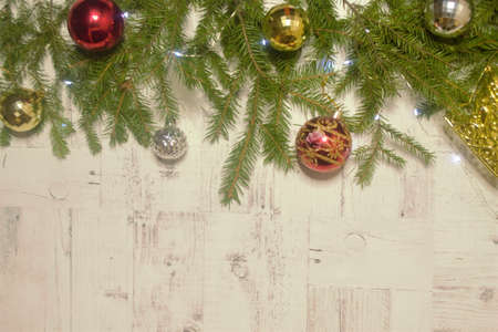 Christmas background with fir branches and Christmas balls with decorationsの写真素材