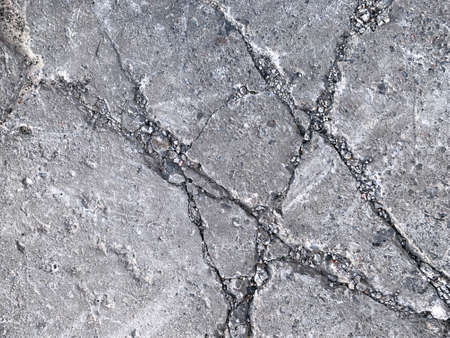 Cracked grey concrete. Urban textured grunge backgrond.の写真素材