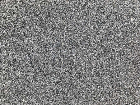 background texture of rough asphalt. Grunge dark walpapers