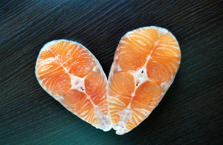 two pieces of fresh fish with lemon and soy sauceの写真素材