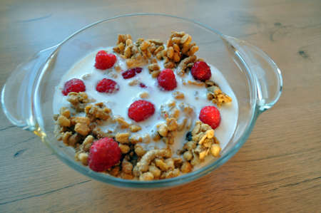 granola from oatmeal - useful breakfast with fruits and milkの写真素材