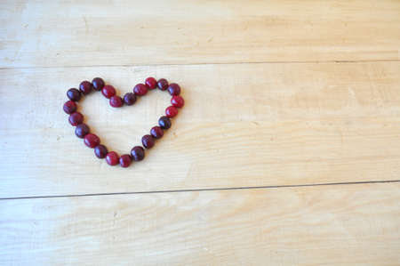elegant heart of red cherries. Valentine's Dayの写真素材
