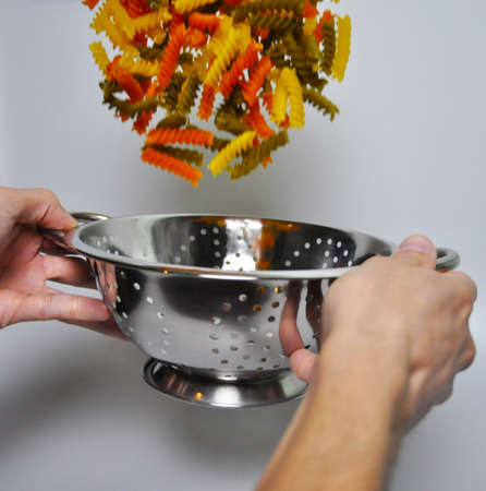 pasta in a colanderの写真素材