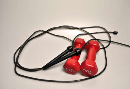 Sports equipment - 1 kg dumbbells and black ropeの写真素材