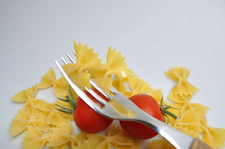 pasta with red cherry tomatoes and green olives