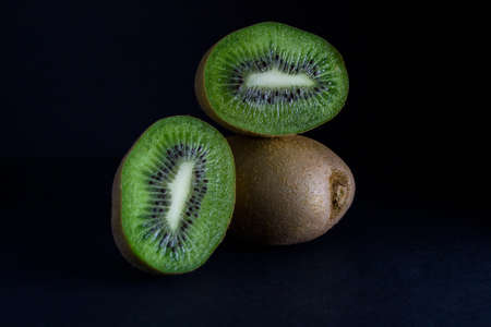 Ripe juicy kiwi on a tableの写真素材