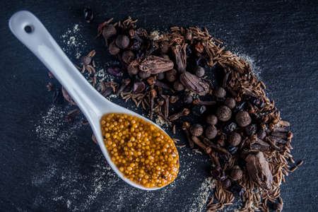 Spices on a table with mustardの写真素材