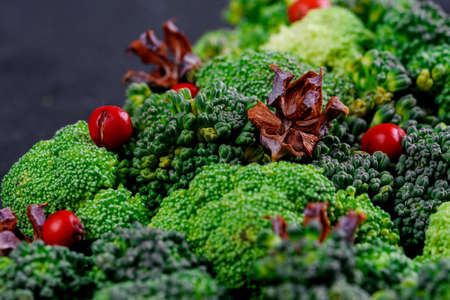 Vegetable and juicy green cabbage tree on the tableの写真素材