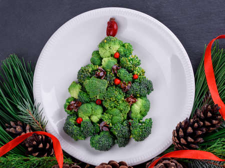 Vegetable and juicy green cabbage tree on the tableの写真素材