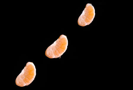 Ripe lobules of mandarins in flight