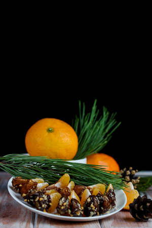 Sweet manadrin in chocolate and nutsの写真素材