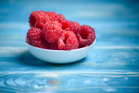 Fresh raspberries on the tableの写真素材