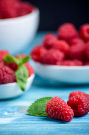 Fresh raspberries on the tableの写真素材