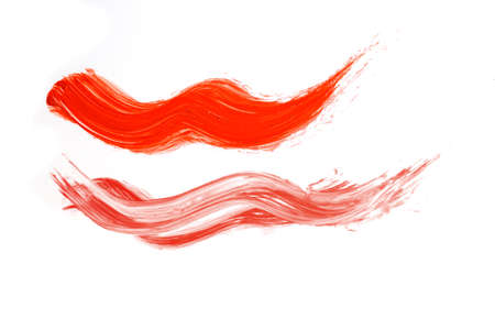 Smear of coral paint isolated on white backgroundの写真素材