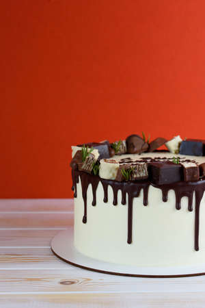 Board with delicious caramel cake on tableの写真素材